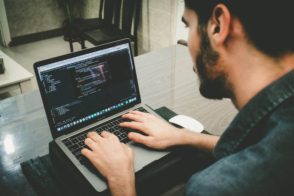 man working on IoT app development